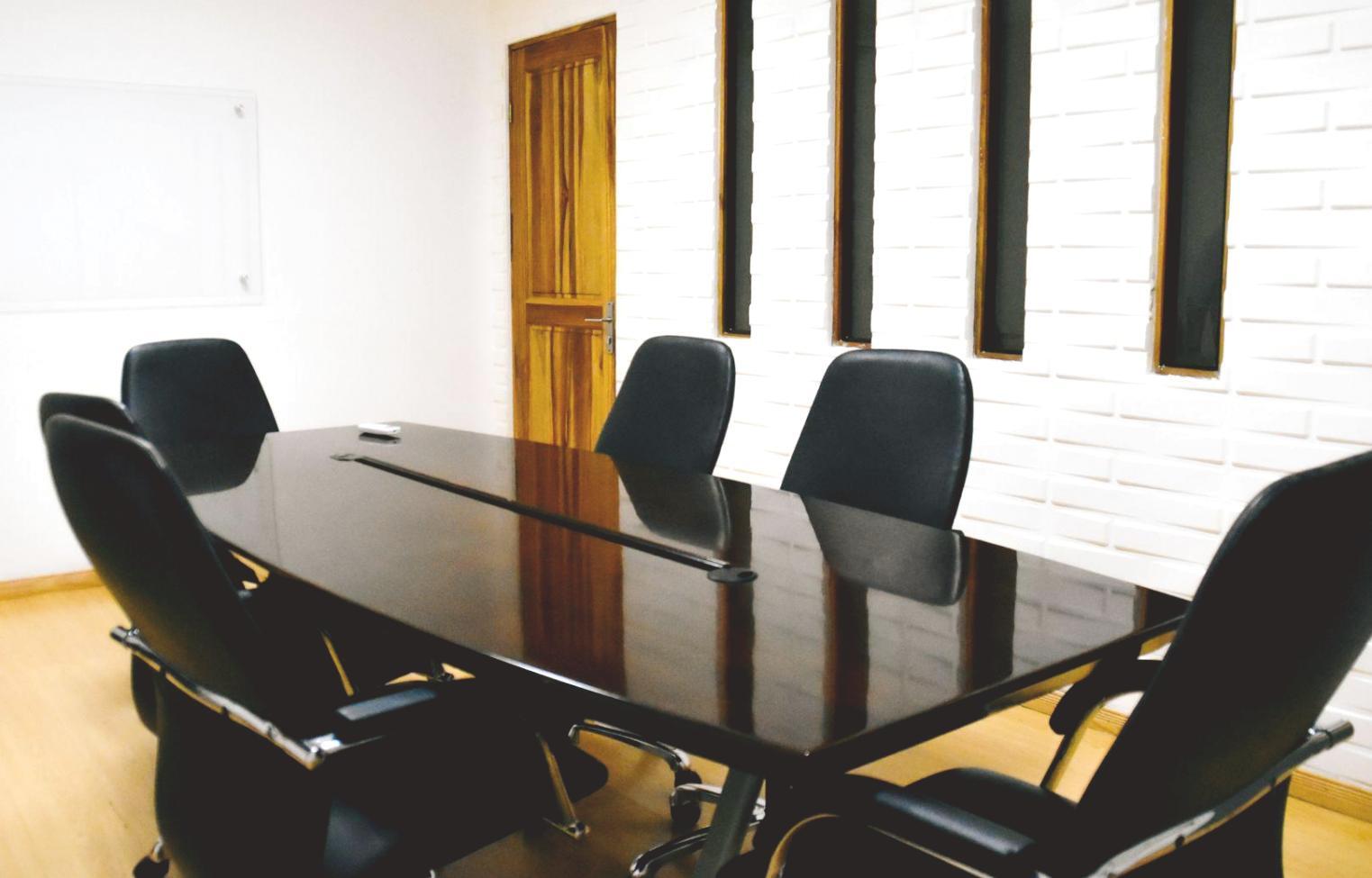 Professional discussing financial strategies in modern office environment